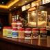 All Snappy Popcorn Salts and Seasoning on a counter at a theater concession stand