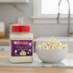 Snappy Parmesan Garlic Popcorn Seasoning next to a bowl of popcorn