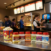 Snappy Popcorn Salts and Savory Popcorn Seasonings being used at a theater concession stand
