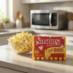 Snappy light butter microwave popcorn in the kitchen with a bowl of popcorn.