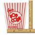 Classic red and white striped popcorn tub with rulers to show the measurement of the tub