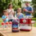 Snappy Cherry Sno Cone Syrup being enjoyed in the backyard