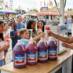 Snappy Cherry Snow Cone Syrup being distributed at a carnival
