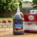Snappy Root Beer Sno Cone Syrup being used with a home snow cone maker