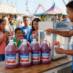 Snappy Strawberry Sno Cone syrup sno cones being enjoyed by people at a fair