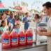 Snappy Bubble Gum Sno Cone syrup sno cones being enjoyed by people at a fair