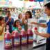 Snappy Fruit Punch Sno Cone syrup sno cones being enjoyed by people at a fair