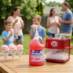 Snappy Cotton Candy Sno Cones being enjoyed at a backyard party.